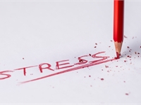 red crayon underlining the word STRESS